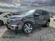 2017 Honda Pilot Elite z VIN 5FNYF6H04HB020693, wystawiony jako Copart lot #81411135 z przebiegiem Nie podano mil oraz Szkoda całkowita • Salvage title. Historia ofert i sprzedaży dostępna na DreamBid. Obrazek 1.