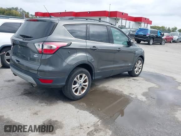 2017 Ford Escape SE with VIN 1FMCU9GD8HUB48301, listed as a IAAI auction lot 43450300 with 74,547 mi miles and . Bid and sale history available at DreamBid. Image 4.