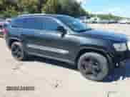 2013 Jeep Grand Cherokee Limited z VIN 1C4RJFBT8DC657129, wystawiony jako IAAI lot #43372561 z przebiegiem 157 836 mil mil oraz . Historia ofert i sprzedaży dostępna na DreamBid. Obrazek 14.