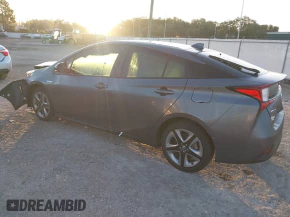 2022 Toyota Prius L Eco with VIN JTDKAMFU4N3175879, listed as a IAAI auction lot 43407344 with 15,599 mi miles and . Bid and sale history available at DreamBid. Image 3.