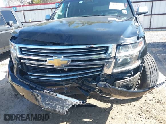 2019 Chevrolet Suburban Premier with VIN 1GNSCJKC5KR360318, listed as a IAAI auction lot 41504344 with 82,997 mi miles and . Bid and sale history available at DreamBid. Image 12.