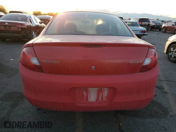 2002 Dodge Neon with VIN 1B3ES26C22D520419, listed as a Copart auction lot 84113104 with 129,714 mi miles and Salvage title. Bid and sale history available at DreamBid. Image 6.