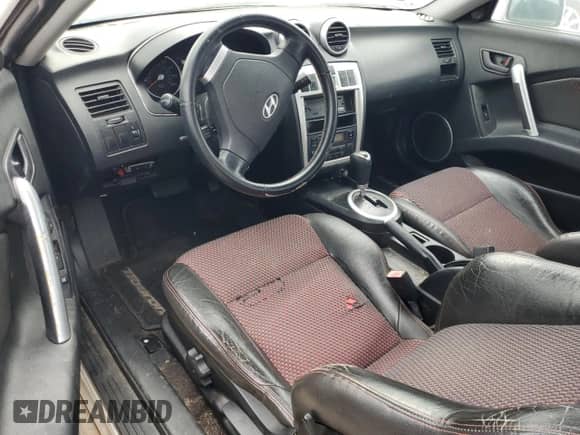 2005 Hyundai Tiburon GT с VIN KMHHN65F45U174430, выставлен на аукционе Copart как лот 70741785 с пробегом Не указан миль и На запчасти • Non repairable. История ставок и продаж доступна на DreamBid. Изображение 8.