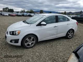 2013 Chevrolet Sonic LTZ с VIN 1G1JE5SG1D4171134, выставлен на аукционе Copart как лот 87035825 с пробегом 151 958 миль миль и Чистый • Clean title. История ставок и продаж доступна на DreamBid. Изображение 1.