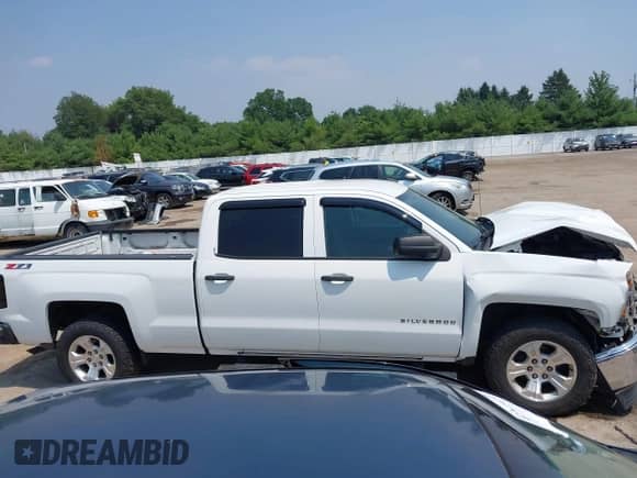 2014 Chevrolet Silverado 1500 LT z VIN 3GCUKREC2EG501235, wystawiony jako IAAI lot #42715436 z przebiegiem 164 781 mil mil oraz . Historia ofert i sprzedaży dostępna na DreamBid. Obrazek 13.