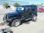 2001 Jeep Wrangler Sahara z VIN 1J4FA59S41P313113, wystawiony jako IAAI lot #42266173 z przebiegiem 125 792 mil mil oraz . Historia ofert i sprzedaży dostępna na DreamBid. Obrazek 2.