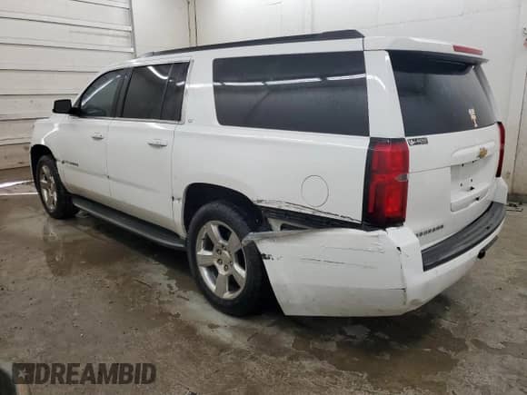2015 Chevrolet Suburban LT with VIN 1GNSKJKC6FR635316, listed as a Copart auction lot 65336185 with 217,006 mi miles and Salvage title. Bid and sale history available at DreamBid. Image 2.