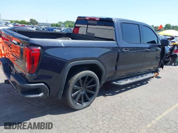 2023 GMC Sierra 1500 AT4 with VIN 1GTUUEE85PZ313956, listed as a IAAI auction lot 42141455 with 41,832 mi miles and . Bid and sale history available at DreamBid. Image 4.