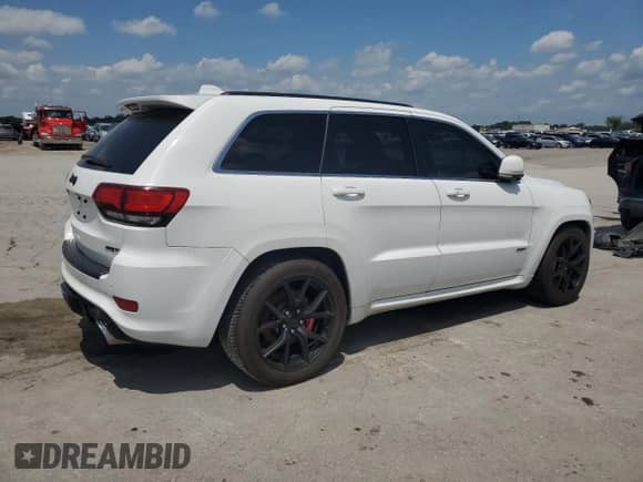 2014 Jeep Grand Cherokee SRT-8 z VIN 1C4RJFDJ3EC169686, wystawiony jako Copart lot #64099815 z przebiegiem 93 401 mil mil oraz Czysty tytuł • Clean title. Historia ofert i sprzedaży dostępna na DreamBid. Obrazek 3.