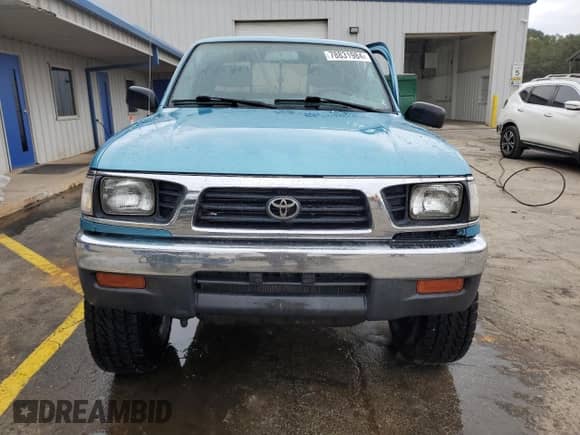 1997 Toyota Tacoma z VIN 4TAWM72NXVZ296658, wystawiony jako Copart lot #78831984 z przebiegiem 228 827 mil mil oraz Szkoda całkowita • Salvage title. Historia ofert i sprzedaży dostępna na DreamBid. Obrazek 5.