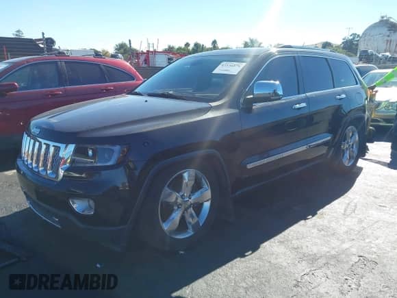 2012 Jeep Grand Cherokee Overland Summit z VIN 1C4RJFCT0CC279563, wystawiony jako IAAI lot #43536876 z przebiegiem 172 943 mil mil oraz . Historia ofert i sprzedaży dostępna na DreamBid. Obrazek 2.