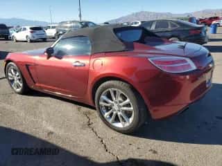 2009 Saturn Sky with VIN 1G8MH35X79Y105127, listed as a Copart auction lot 86133424 with 76,747 mi miles and Salvage title. Bid and sale history available at DreamBid. Image 2.