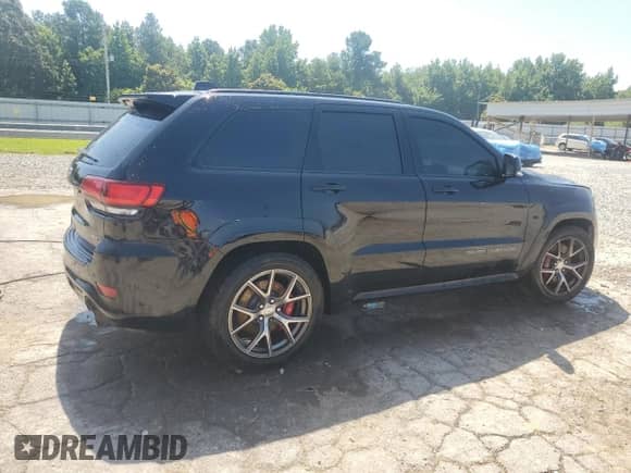 2017 Jeep Grand Cherokee SRT z VIN 1C4RJFDJ5HC957079, wystawiony jako Copart lot #61977395 z przebiegiem 144 029 mil mil oraz Czysty tytuł • Clean title. Historia ofert i sprzedaży dostępna na DreamBid. Obrazek 3.