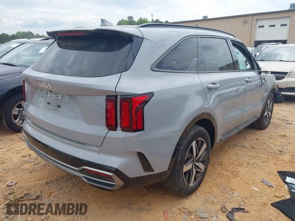 2023 Kia Sorento EX with VIN 5XYRH4LFXPG197495, listed as a IAAI auction lot 42102185 with 34,736 mi miles and . Bid and sale history available at DreamBid. Image 4.