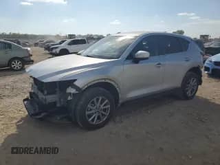 2023 Mazda CX-5 S Select z VIN JM3KFBBM9P0122098, wystawiony jako Copart lot #86244005 z przebiegiem 27 892 mil mil oraz Szkoda całkowita • Salvage title. Historia ofert i sprzedaży dostępna na DreamBid. Obrazek 1.