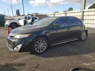 2014 Toyota Camry XLE with VIN 4T1BK1FKXEU545233, listed as a Copart auction lot 90062335 with 142,633 mi miles and Salvage title. Bid and sale history available at DreamBid. Image 1.