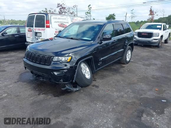 2020 Jeep Grand Cherokee Laredo E with VIN 1C4RJEAG7LC246477, listed as a IAAI auction lot 43113752 with 26,198 mi miles and . Bid and sale history available at DreamBid. Image 17.