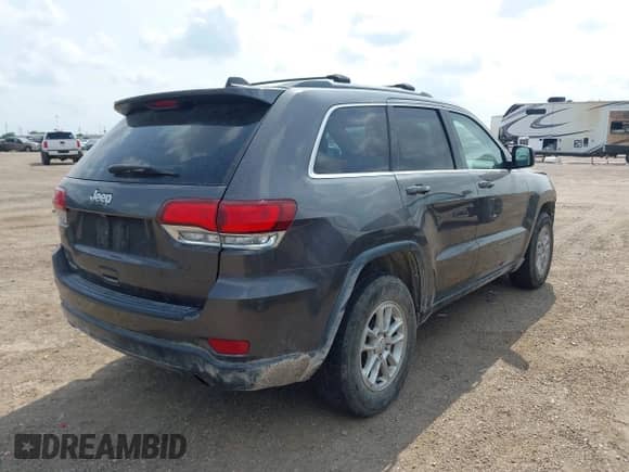 2020 Jeep Grand Cherokee Laredo E with VIN 1C4RJEAG2LC284912, listed as a IAAI auction lot 42114881 with 86,579 mi miles and . Bid and sale history available at DreamBid. Image 4.