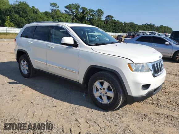 2012 Jeep Grand Cherokee Laredo z VIN 1C4RJEAG7CC137663, wystawiony jako Copart lot #71826435 z przebiegiem 96 982 mil mil oraz Szkoda całkowita • Salvage title. Historia ofert i sprzedaży dostępna na DreamBid. Obrazek 4.