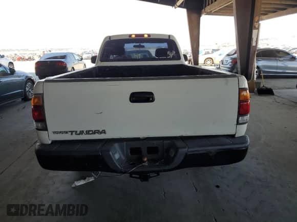2002 Toyota Tundra z VIN 5TBJN32142S303241, wystawiony jako Copart lot #64789225 z przebiegiem 216 962 mil mil oraz Czysty tytuł • Clean title. Historia ofert i sprzedaży dostępna na DreamBid. Obrazek 6.