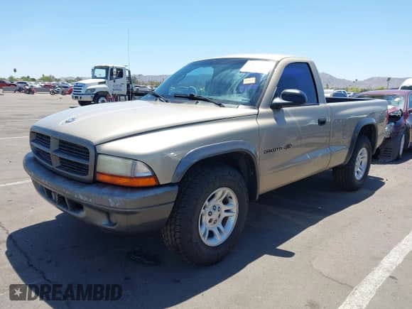 2002 Dodge Dakota z VIN 1B7FL16X72S642881, wystawiony jako IAAI lot #42153560 z przebiegiem 220 917 mil mil oraz . Historia ofert i sprzedaży dostępna na DreamBid. Obrazek 2.