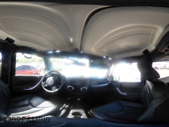 2016 Jeep Wrangler Sahara z VIN 1C4AJWBG2GL108479, wystawiony jako IAAI lot #43295339 z przebiegiem 57 237 mil mil oraz . Historia ofert i sprzedaży dostępna na DreamBid. Obrazek 19.