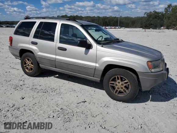 2004 Jeep Grand Cherokee Laredo with VIN 1J4GX48S64C302687, listed as a Copart auction lot 85599075 with 213,057 mi miles and Salvage title. Bid and sale history available at DreamBid. Image 4.