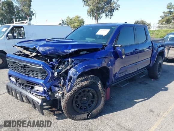 2024 Toyota Tacoma TRD Off Road with VIN 3TMLB5JN8RM074856, listed as a IAAI auction lot 43139396 with 8,137 mi miles and . Bid and sale history available at DreamBid. Image 2.