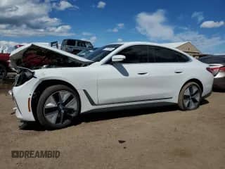 2024 BMW i4 xDrive40 with VIN WBY83FB01RFT37862, listed as a Copart auction lot 57124985 with 8,887 mi miles and Salvage title. Bid and sale history available at DreamBid. Image 1.