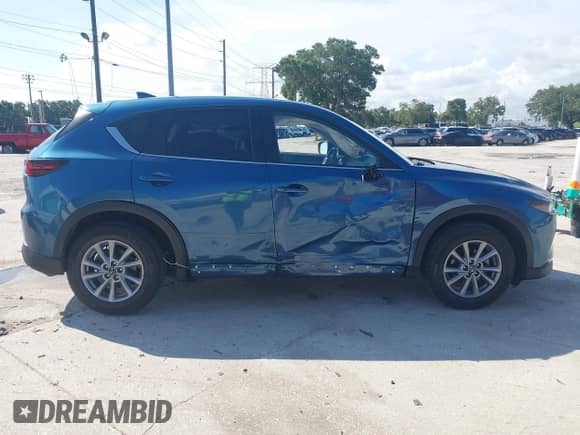 2023 Mazda CX-5 S Carbon Edition z VIN JM3KFBCM6P0112207, wystawiony jako IAAI lot #42747977 z przebiegiem 33 488 mil mil oraz . Historia ofert i sprzedaży dostępna na DreamBid. Obrazek 13.