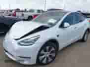 2021 Tesla Model Y Long Range with VIN 5YJYGDEE0MF095080, listed as a IAAI auction lot 42931169 with Not provided miles and . Bid and sale history available at DreamBid. Image 2.