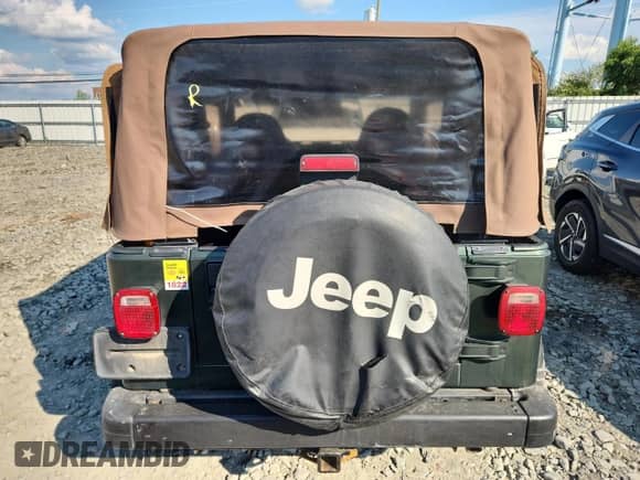 1997 Jeep Wrangler Sport with VIN 1J4FY19S0VP430844, listed as a Copart auction lot 65827275 with 91,868 mi miles and Salvage title. Bid and sale history available at DreamBid. Image 6.