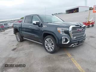 2021 GMC Sierra 1500 Denali z VIN 1GTU9FET6MZ366141, wystawiony jako IAAI lot #42783152 z przebiegiem 84 763 mil mil oraz . Historia ofert i sprzedaży dostępna na DreamBid. Obrazek 1.