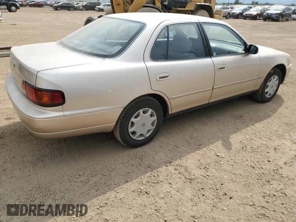 1996 Toyota Camry DX z VIN JT2BG12K4T0391773, wystawiony jako Copart lot #68545815 z przebiegiem 103 853 mil mil oraz Szkoda całkowita • Salvage title. Historia ofert i sprzedaży dostępna na DreamBid. Obrazek 3.