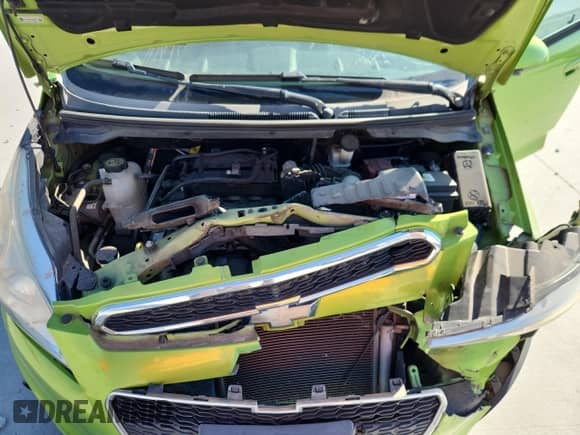 2014 Chevrolet Spark LS with VIN KL8CB6S94EC565436, listed as a Copart auction lot 86057295 with 106,927 mi miles and Salvage title. Bid and sale history available at DreamBid. Image 12.