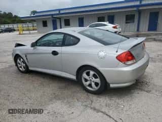 2006 Hyundai Tiburon GS with VIN KMHHM65D16U219309, listed as a Copart auction lot 86110765 with 166,452 mi miles and Clean title. Bid and sale history available at DreamBid. Image 2.