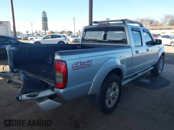 2003 Nissan Frontier SVE with VIN 1N6MD29Y63C465571, listed as a IAAI auction lot 41502613 with 175,996 mi miles and . Bid and sale history available at DreamBid. Image 4.