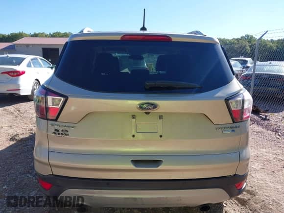 2017 Ford Escape Titanium with VIN 1FMCU9J95HUD42000, listed as a IAAI auction lot 43387558 with 122,185 mi miles and . Bid and sale history available at DreamBid. Image 17.