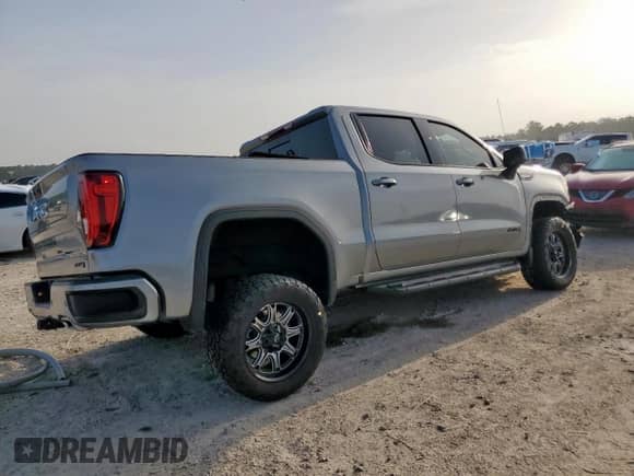 2023 GMC Sierra 1500 AT4 with VIN 1GTUUEE88PZ187558, listed as a Copart auction lot 62832805 with 30,019 mi miles and Salvage title. Bid and sale history available at DreamBid. Image 3.