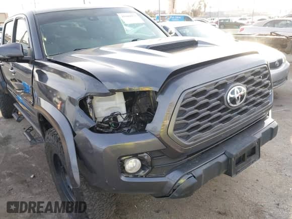 2021 Toyota Tacoma SR5 z VIN 3TMDZ5BN2MM108586, wystawiony jako IAAI lot #41604953 z przebiegiem 65 422 mil mil oraz . Historia ofert i sprzedaży dostępna na DreamBid. Obrazek 6.