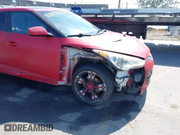 2013 Hyundai Veloster w/Black Int z VIN KMHTC6AD4DU101917, wystawiony jako IAAI lot #43406444 z przebiegiem 124 547 mil mil oraz . Historia ofert i sprzedaży dostępna na DreamBid. Obrazek 6.