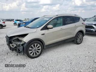 2017 Ford Escape Titanium с VIN 1FMCU0JD7HUB60105, выставлен на аукционе Copart как лот 81084435 с пробегом 104 682 миль миль и Списание • Salvage title. История ставок и продаж доступна на DreamBid. Изображение 1.