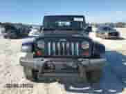 2010 Jeep Wrangler Sahara с VIN 1J4AA5D15AL152772, выставлен на аукционе Copart как лот 84934065 с пробегом 158 263 миль миль и Списание • Salvage title. История ставок и продаж доступна на DreamBid. Изображение 5.