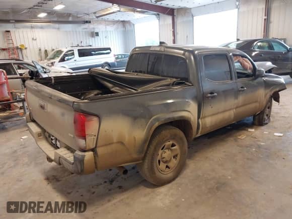 2023 Toyota Tacoma SR with VIN 3TMCZ5AN0PM540529, listed as a IAAI auction lot 43088233 with 75,792 mi miles and . Bid and sale history available at DreamBid. Image 4.