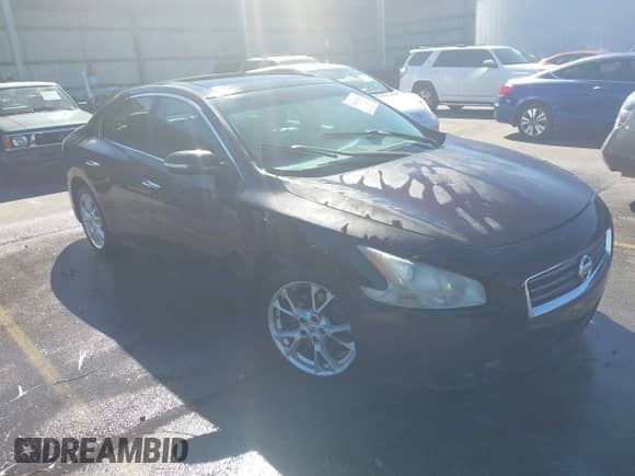 2012 Nissan Maxima S z VIN 1N4AA5AP4CC805938, wystawiony jako IAAI lot #43423540 z przebiegiem 182 388 mil mil oraz . Historia ofert i sprzedaży dostępna na DreamBid. Obrazek 1.