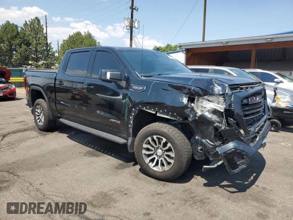 2022 GMC Sierra 1500 AT4 with VIN 1GTP9EEL1NZ233974, listed as a Copart auction lot 68958775 with 100,439 mi miles and Salvage title. Bid and sale history available at DreamBid. Image 4.