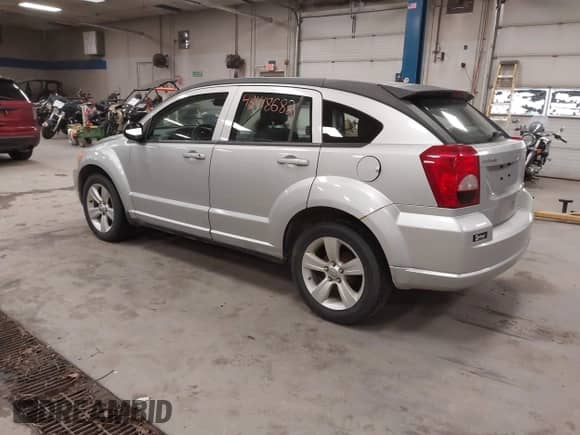 2010 Dodge Caliber Mainstreet with VIN 1B3CB3HA5AD567399, listed as a IAAI auction lot 43418682 with 196,239 mi miles and . Bid and sale history available at DreamBid. Image 3.
