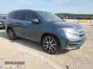 2021 Honda Pilot Elite z VIN 5FNYF6H07MB082065, wystawiony jako Copart lot #60275085 z przebiegiem 87 737 mil mil oraz Szkoda całkowita • Salvage title. Historia ofert i sprzedaży dostępna na DreamBid. Obrazek 4.