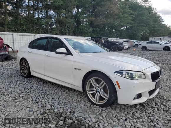 2016 BMW 5 Series 550i xDrive with VIN WBAKP9C55GD981149, listed as a Copart auction lot 65976265 with 121,838 mi miles and Salvage title. Bid and sale history available at DreamBid. Image 4.