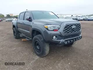2021 Toyota Tacoma SR with VIN 3TMCZ5AN3MM450562, listed as a IAAI auction lot 43071461 with 15,850 mi miles and . Bid and sale history available at DreamBid. Image 1.